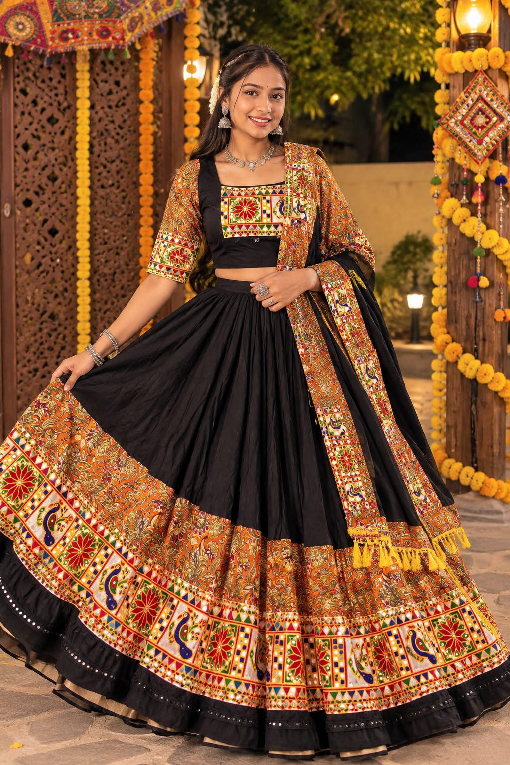 Woman in a black chaniya choli with a colourful peacock mirror border